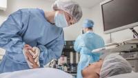 Nurse caring for patient.